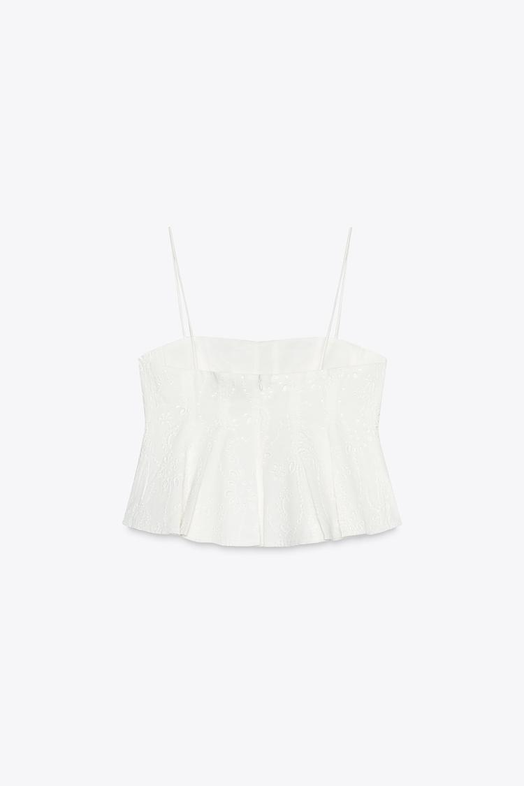 Conjunto de falda capa y top con godets bordados